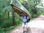 Jeff carries the canoe